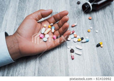 medicine in hand woman on table background medicine in hand woman on table background 61410992