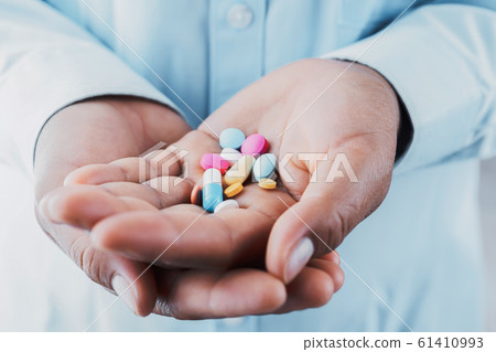doctor holding medicine on hand. concept health doctor holding medicine on hand. concept health 61410993