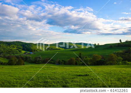 Scenic panoramic view of rolling countryside green Scenic panoramic view of rolling countryside green 61412261