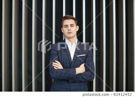 Confident young businessman Confident young businessman 61412452