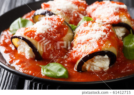 Baked eggplant roll with ricotta cheese in tomato Baked eggplant roll with ricotta cheese in tomato 61412715