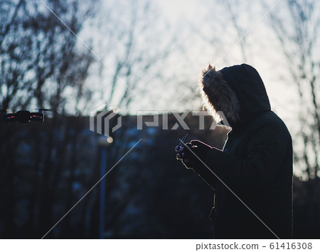 bearded man use flying drone bearded man use flying drone 61416308
