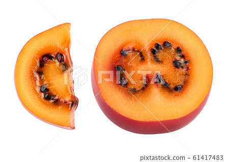 Fresh tamarillo fruit half isolated on white background Fresh tamarillo fruit half isolated on white background 61417483