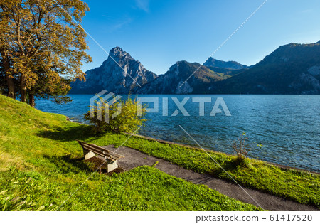 Peaceful autumn Alps mountain lake. Morning view 61417520