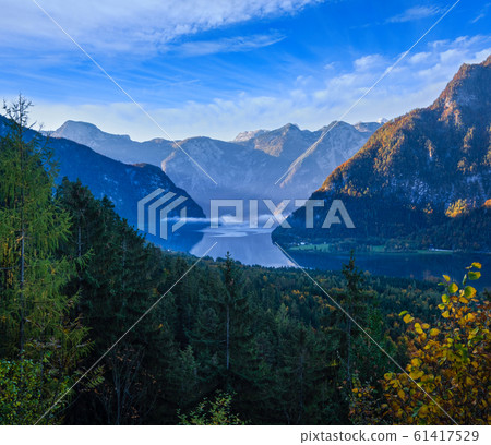 Peaceful morning autumn Alps mountain lake with Peaceful morning autumn Alps mountain lake with 61417529