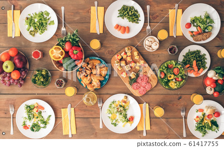 Big festive table with a huge amount of delicious, healthy food 61417755