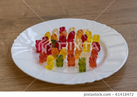 Colorful Gummy Bears on a plate 61418472
