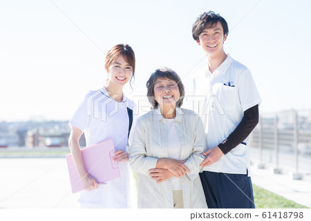 Senior woman and nurse 61418798