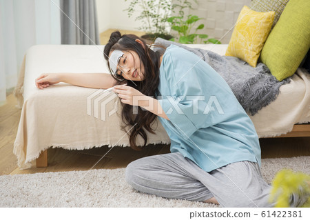 Woman cold fever influenza poor health thermometer 61422381