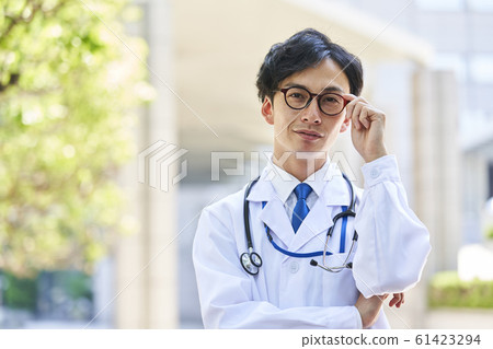 A young man wearing a white suit A young man wearing a white suit 61423294