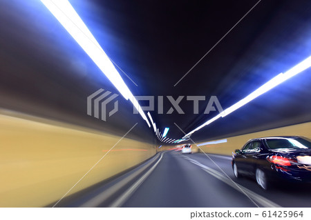 Car traveling in the Metropolitan Takayama Yamate Tunnel Car traveling in the Metropolitan Takayama Yamate Tunnel 61425964