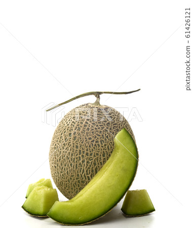 Fresh green melon and slice on white Fresh green melon and slice on white 61426121