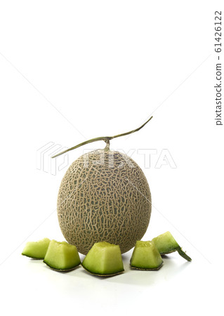 Fresh green melon and slice on white Fresh green melon and slice on white 61426122