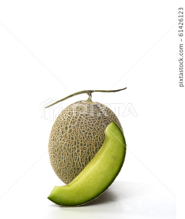 Fresh green melon and slice on white Fresh green melon and slice on white 61426123