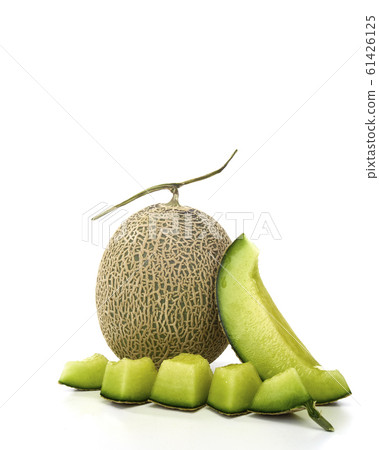 Fresh green melon and slice on white Fresh green melon and slice on white 61426125