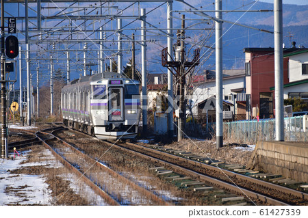 Photo of the Hakodate liner arriving at Nanae Station in Nanae-cho, Hokkaido in winter 61427339