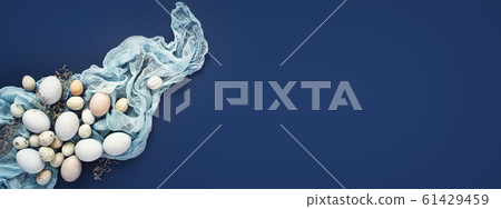 Easter background with painted eggs and napkin on 61429459