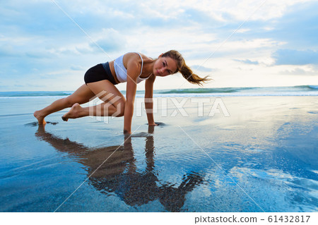 Sporty woman doing mountain climber exercise - run Sporty woman doing mountain climber exercise - run 61432817