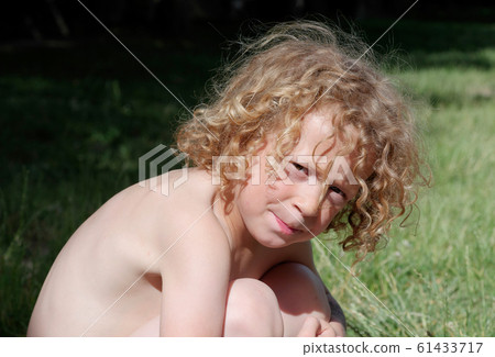 Portrait of a little blond boy, outside Portrait of a little blond boy, outside 61433717
