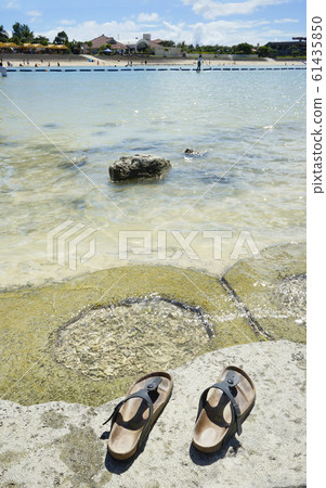 Sandal beach located on the beach of Sunset Beach in American Village in Chatan Town, Okinawa Sandal beach located on the beach of Sunset Beach in American Village in Chatan Town, Okinawa 61435850