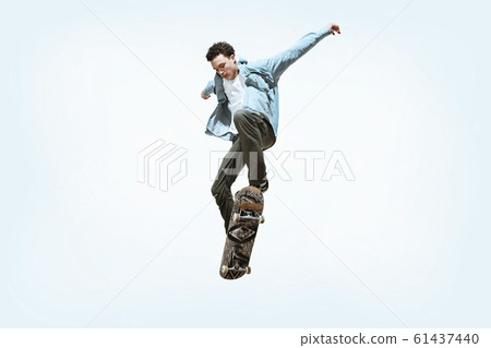 Caucasian young skateboarder riding isolated on a white background Caucasian young skateboarder riding isolated on a white background 61437440