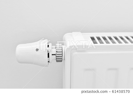 Photo of house interior with radiator - heating. Photo of house interior with radiator - heating. 61438570