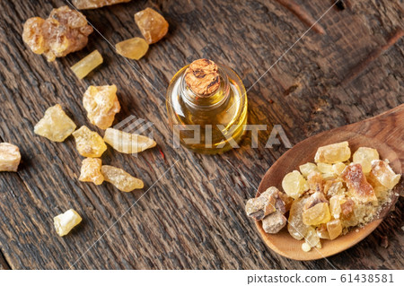 A bottle of frankincense essential oil with frankincense resin 61438581