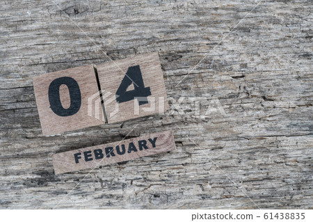 cube calendar for february on wooden background 61438835