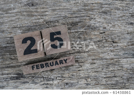 cube calendar for february on wooden background 61438861