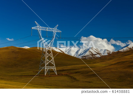 pylons of high-voltage power lines in the mountains 61438881