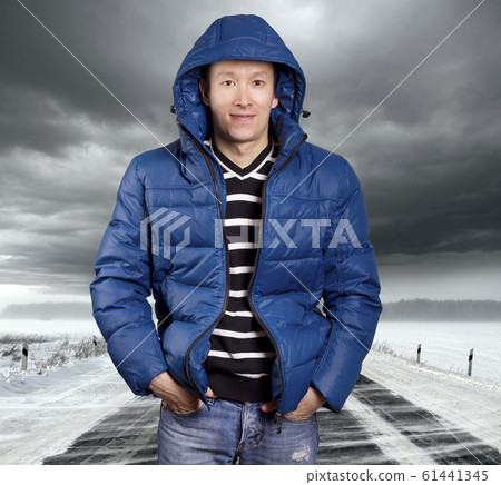 Asian man stand on snow road in winter Asian man stand on snow road in winter 61441345