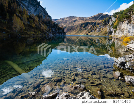 Sunny autumn alpine Tappenkarsee lake and rocky Sunny autumn alpine Tappenkarsee lake and rocky 61441493