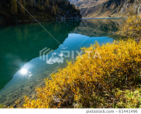Sunny autumn alpine Tappenkarsee lake and rocky Sunny autumn alpine Tappenkarsee lake and rocky 61441496