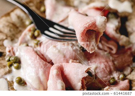 Vitello tonnato sliced veal Vitello tonnato sliced veal 61441687