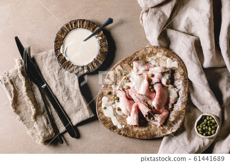Vitello tonnato sliced veal Vitello tonnato sliced veal 61441689
