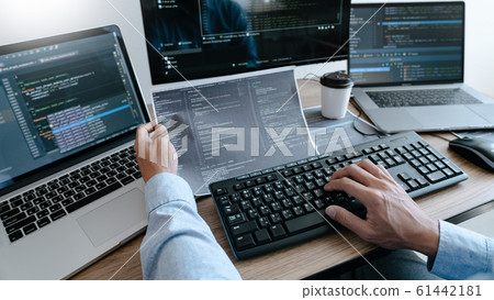 Programmer working On Computer In IT Office Typing 61442181