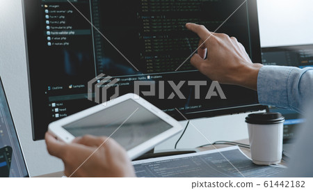 Programmer working On Computer In IT Office Typing 61442182