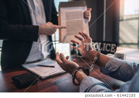 Police officer interrogating suspect or criminal Police officer interrogating suspect or criminal 61442185