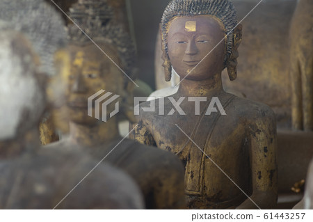 Ancient Coral reef Buddha state at public place in 61443257