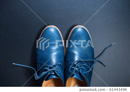 Blue men's leather shoes on dark background Blue men's leather shoes on dark background 61443496