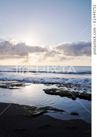 Breathtaking sunrise on beach in El Medano, Tenerife, Canary Islands, Spain, sunny cloudy blue sky with copy space Breathtaking sunrise on beach in El Medano, Tenerife, Canary Islands, Spain, sunny cloudy blue sky with copy space 61444752