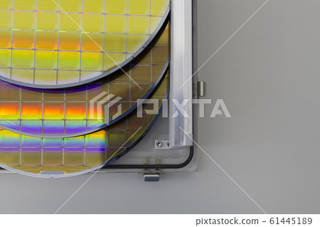 Silicon Wafers in steel holder box on a table- A 61445189