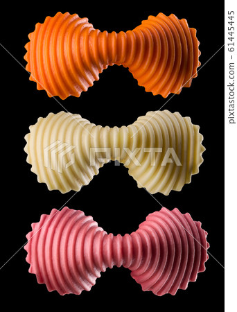 Set of colourful farfalle pasta isolated on black background Set of colourful farfalle pasta isolated on black background 61445445
