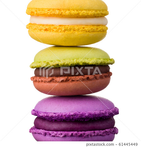 Stack of french colorful macaroons on table isolated on white background Stack of french colorful macaroons on table isolated on white background 61445449