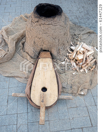 Old woodworking hand tool: wooden plane, chisel ax, sledgehammer, hammer and in a carpentry workshop on dirty rustic table covered with sawdust background side view 61447129