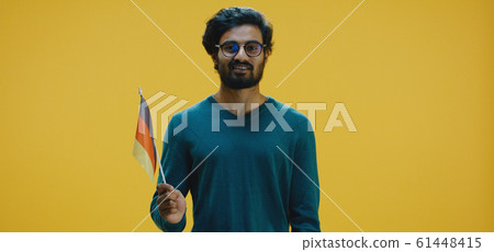 Young man waving the German flag 61448415