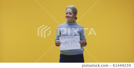 Woman holding 10 percent discount sign 61449239