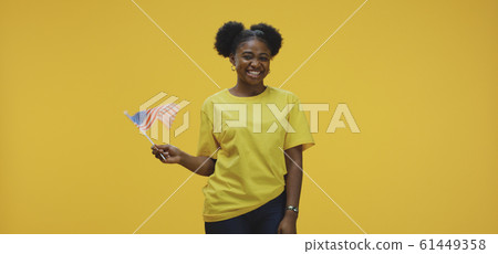 Woman waving US flag Woman waving US flag 61449358