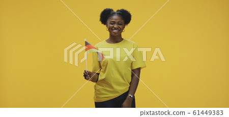 Woman waving German flag Woman waving German flag 61449383
