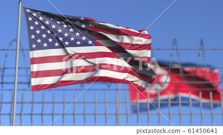 Waving flags of the USA and North Korea separated by barbed wire fence. Conflict related conceptual 3D rendering 61450641